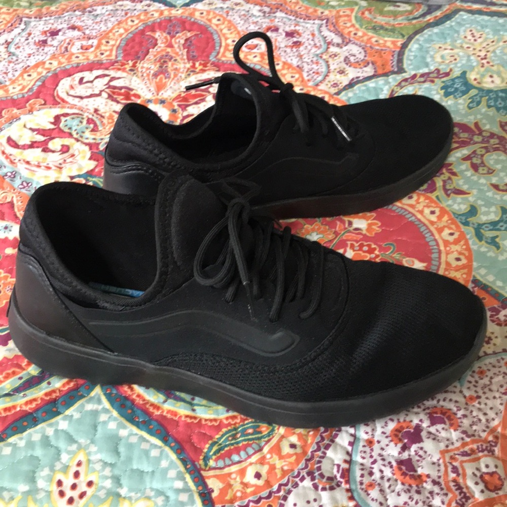 Solid black Vans